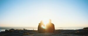 Photo of a couple watching a sunset, indicating couples counseling in Denver.
