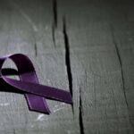 purple ribbon against the violence against women | Catalyst Center