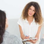 Serious therapist listening to her talking patient | Catalyst Center therapy