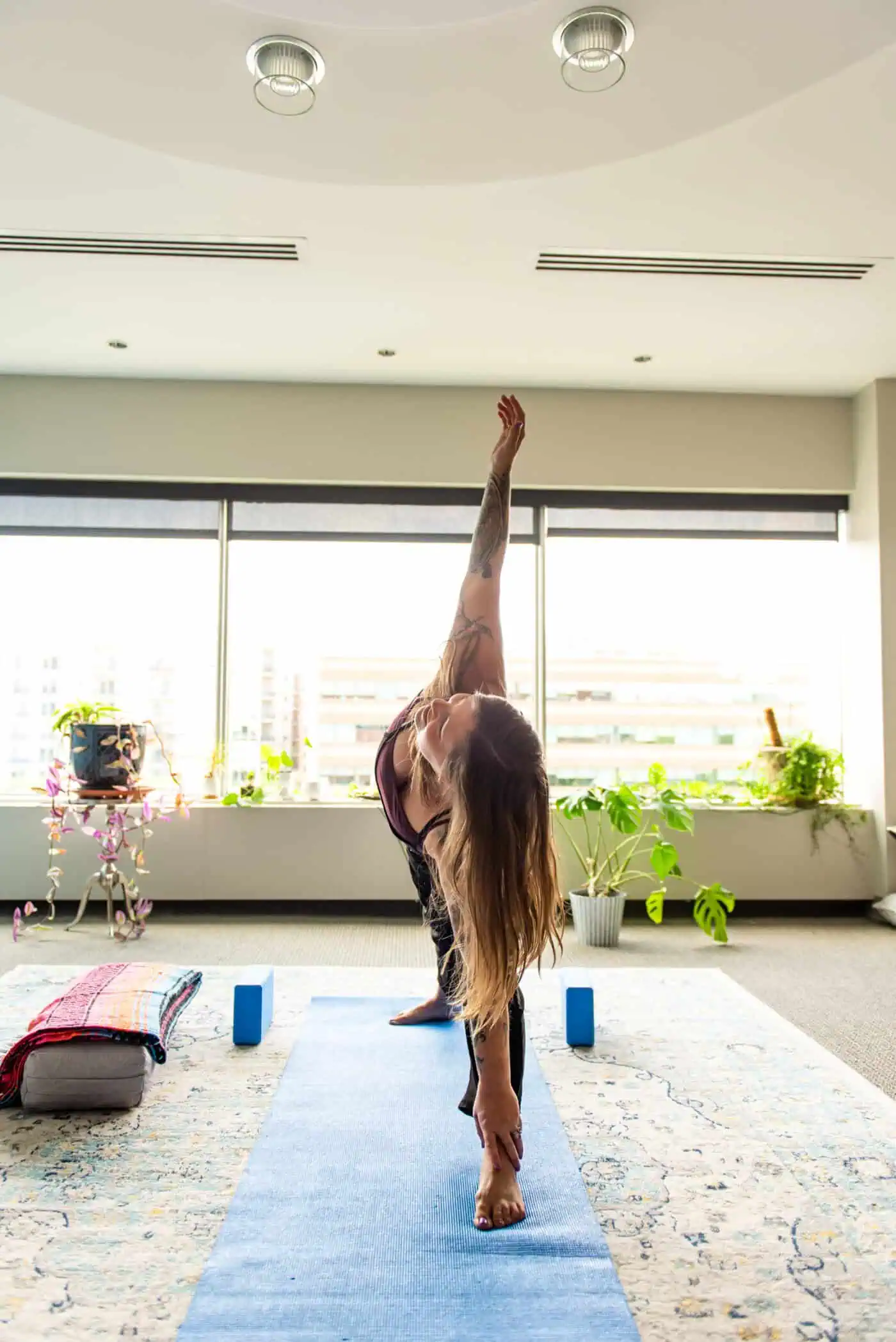 A photo of Jennifer in the yoga space she teaches in.