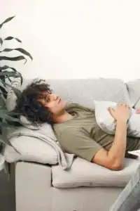 man laying on therapist couch