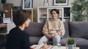 Therapist and client engaged in caring, collaborative conversation.