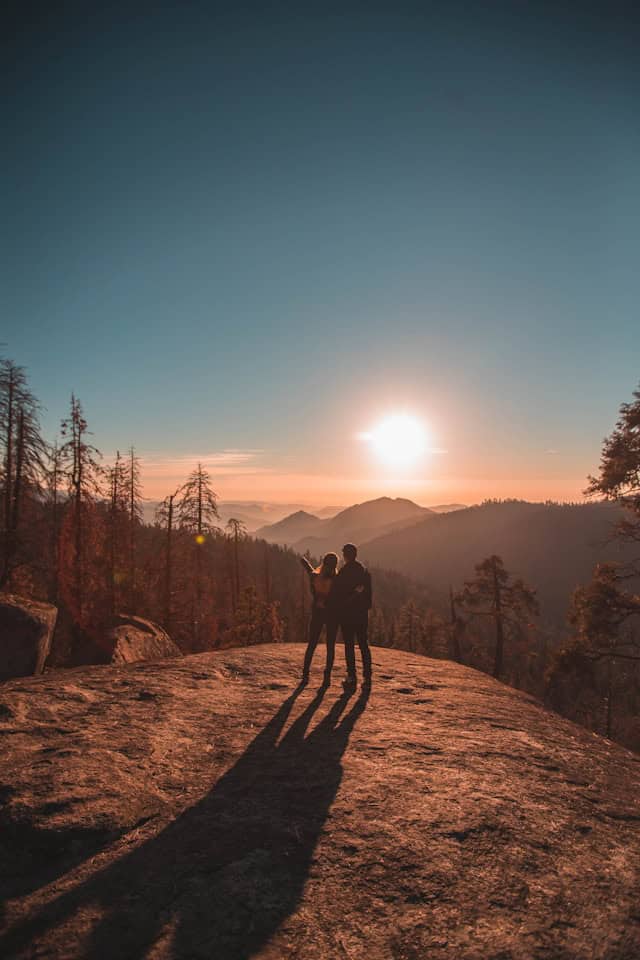 Two people sitting together in a relaxed, comfortable setting, representing the supportive dynamic of neurodivergent relationships explored in therapy.