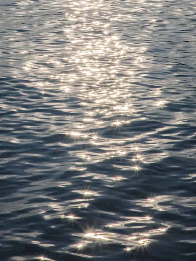 Light dissolving and refracting through water, suggesting fluid perception